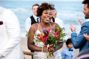 Photo of bride by a destination wedding photographer on the beach
